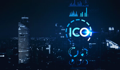 Blue hologram of ICO icon and office skyscrapers at night