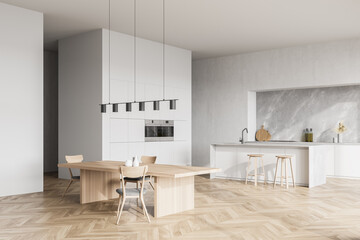 Fototapeta na wymiar Modern contemporary design kitchen room interior. Dining table with chairs. Parquet flooring. White and wood material.