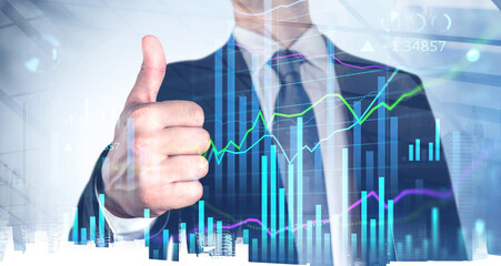 Businessman give a thumb up, double exposure with financial statistics