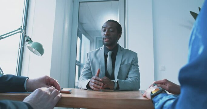 African businessman discussing details of agreement 
