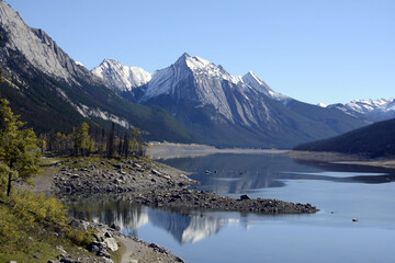Fototapeta na wymiar Alberta, Canada the Rocky mountains and the forest reflected in the lake water