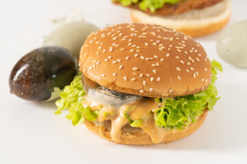 Chinese characteristic preserved egg burgers on a solid background
