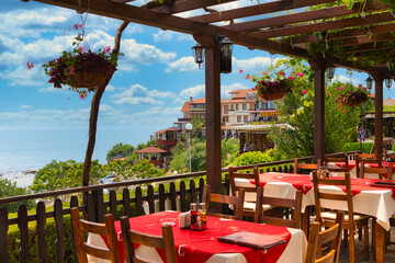 NESSEBAR, BULGARIA, JUNY 18, 2016: cozy cafes on the waterfront town of Nessebar