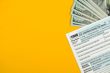 Naklejka premium Income tax return concept background, business workspace and desktop with money or cash