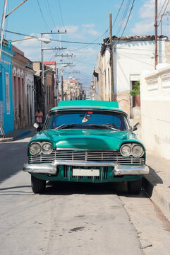 Retro car on road of old city