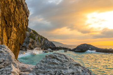 Evening Rocky Shore and Sea Surf Splashes