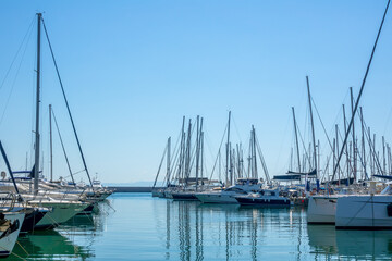 Fototapeta na wymiar Plenty of Sailing Yachts in the Boat Parking Lot on a Sunny Summer Day