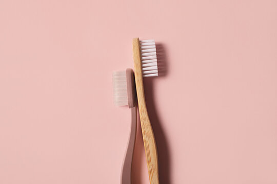 Eco / environmentally friendly products - toothbrushes on pink background