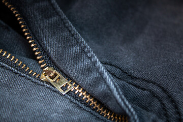 Denim with zipper. Background on the theme of denim clothing.