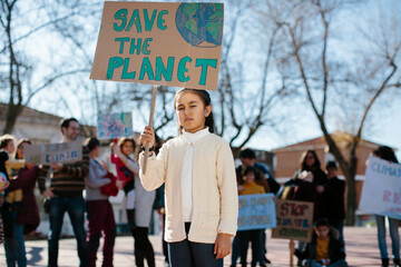 Young girl carrying a banner