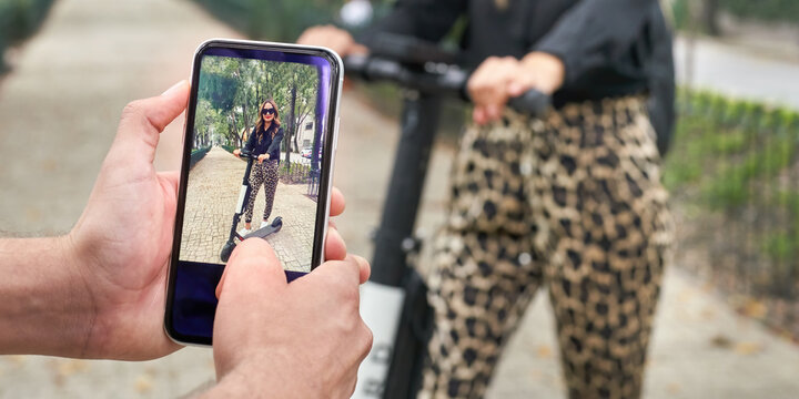 Electric scooter user posing