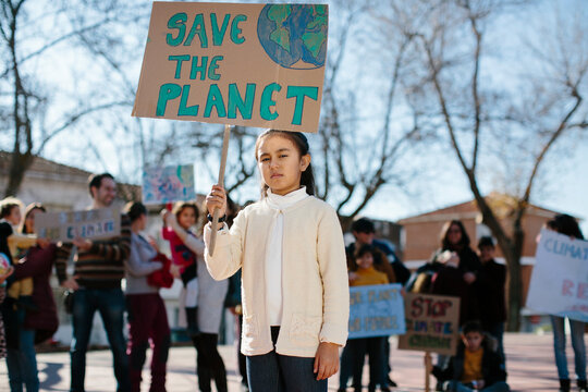 Young girl carrying a banner