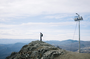 Young man on the top of the hill