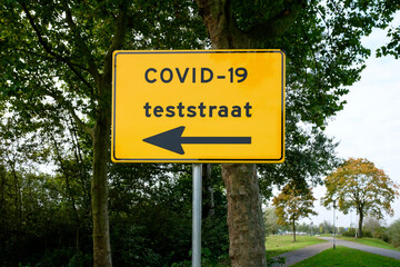 Corona test street direction sign in The Netherlands. Translation (Dutch):  "COVID-19 test street".