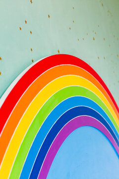 Detail of a rainbow-themed bed