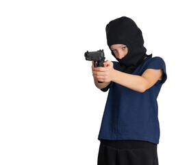 boy in a mask or balaclava with a pistol in his hands, takes aim at someone, on an isolated background. child crime symbol