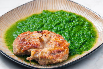 still life of pork cutlet with spinach