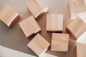 Wooden cubes from natural wood on a white background. Copy, empty space for text
