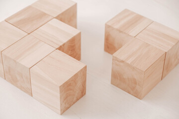 Stack wooden blocks from natural wood on a white background. Copy, empty space for text