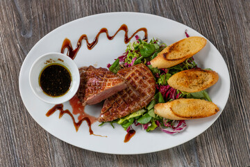grilled duck breast with honey sauce and salad