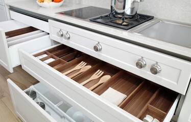 Modern kitchen, Open drawers, Set of cutlery trays in kitchen drawer. Solid oak wood cutlery drawer...