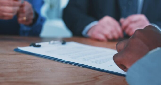 Close up of a busineswoman handing over a contract to a businessman 