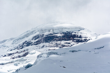 Fototapeta na wymiar Cotopaxi volcano with lots of snow 