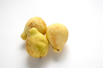Couple Guava Fruits And Slices Isolated on White Background yellow guava fruit isolated on white background. Egyptian fruit. Couple Guava Fruits And Slices Isolated.