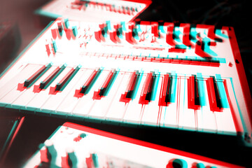 Midi synthesizer keyboard in sound recording studio edited with retro 3D anaglyph...