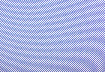 Close up of white and blue striped textile background.