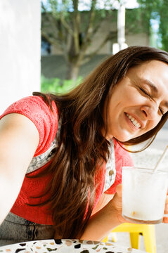 happy female with cocktail