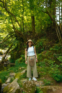 A Woman Visiting the Source of Yahagi River in Deep Forest in Nagano, Japan