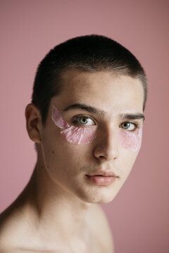 Portrait Of Young Man With Petal Composition On The Face
