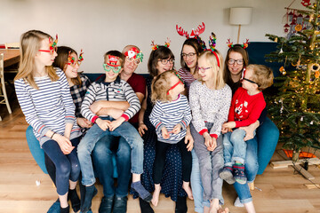 large family in cute Christmas glasses