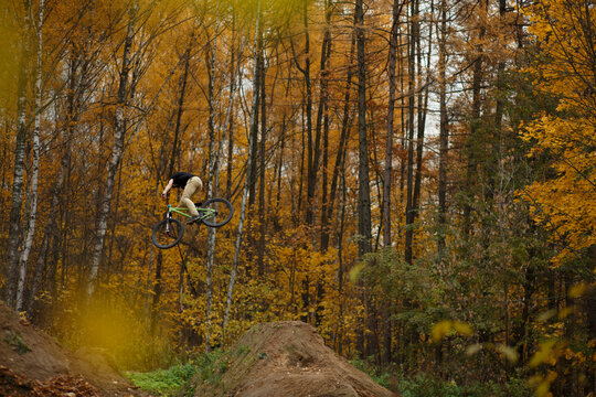 Extreme dirt jump rider on bicycle