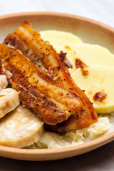 pork meat with two types of dumplings and cabbage