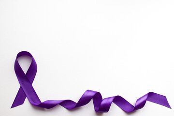 Purple ribbon on white background with place for text in honor of the day of patients with epilepsy on March 26 - obrazy, fototapety, plakaty