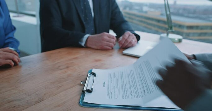 Close up of an African man hands signing contract