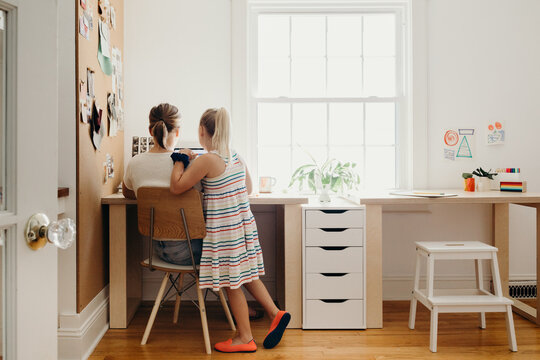 Mom Working From Home with Daughter
