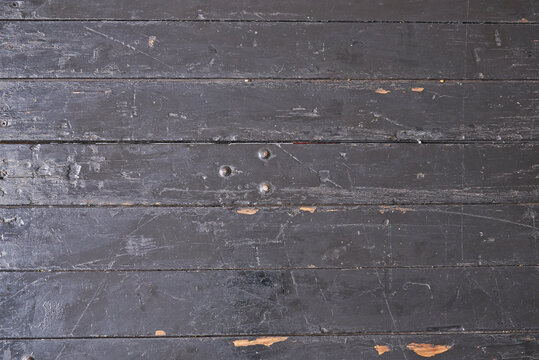 Weathered rustic and grungy black plank from table in top view