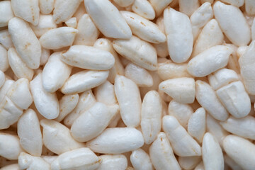 Dry white puffed rice .  Blown rice. 