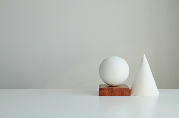 Stylish interior mockup with white geometric shapes of a ball and a cone