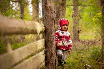 A little boy wearing a uniform