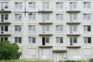 Abandoned Building facade With Balconies And Windows