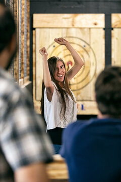 Woman Excited After Hitting Bullseye With Hatchet