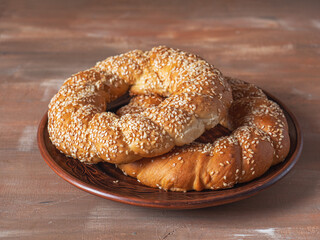 Homemade cakes, large butter rolls with sesame seeds