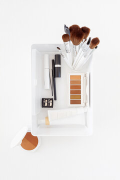 Cosmetics and Brushes in Container
