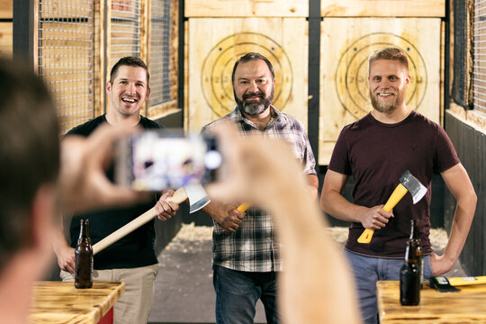 Axe Throwing Guys Get A Photo Together