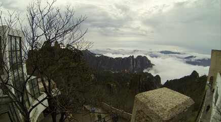 China Mount HuangShan - April, 2015: Natural scenery, sunsets, peculiarly-shaped granite peaks, Huangshan pine trees and views of the clouds from above. Photo taken in Yellow Mountain (UNESCO).