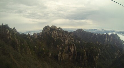 China Mount HuangShan - April, 2015: Natural scenery, sunsets, peculiarly-shaped granite peaks, Huangshan pine trees and views of the clouds from above. Photo taken in Yellow Mountain (UNESCO).